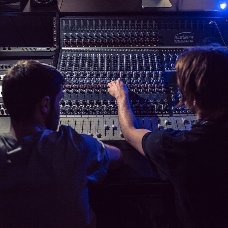 ACC Students on mixing desk | ACC Degrees