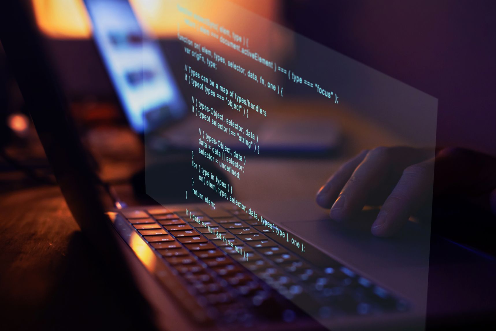 Student programming software on their laptop