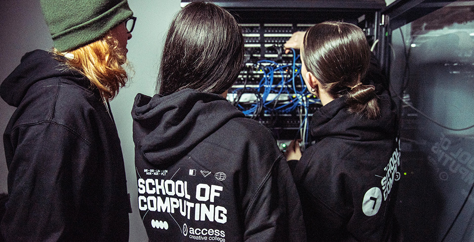 a group of computing students fixing wires