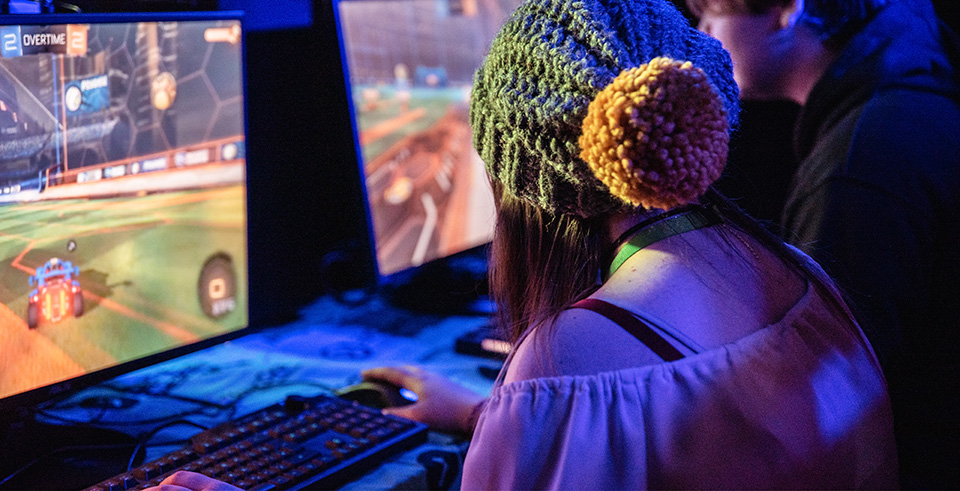 A student in a hat playing games
