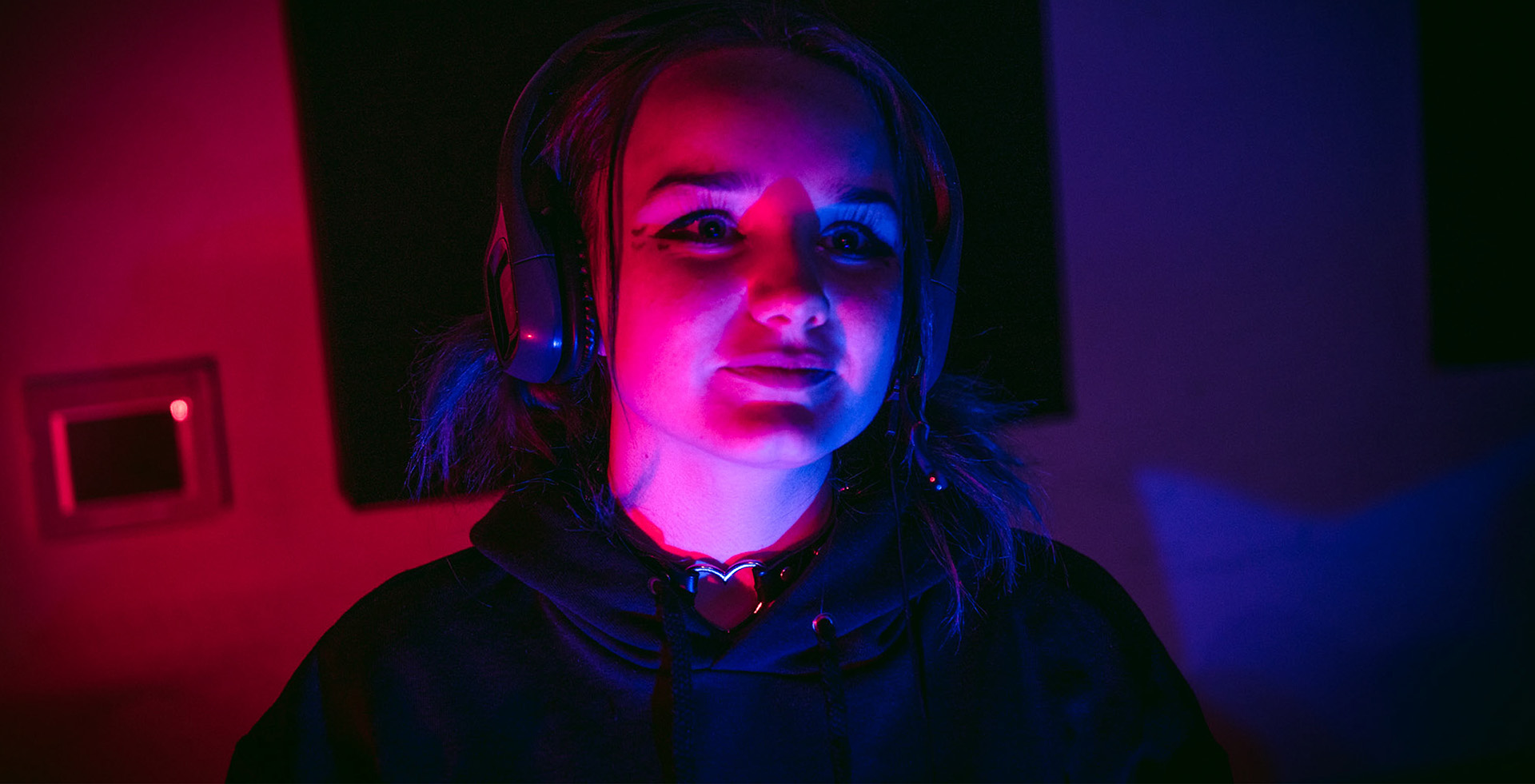 a student wearing headphones in LED lighting