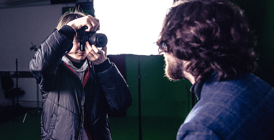 Two people conducting a photoshoot