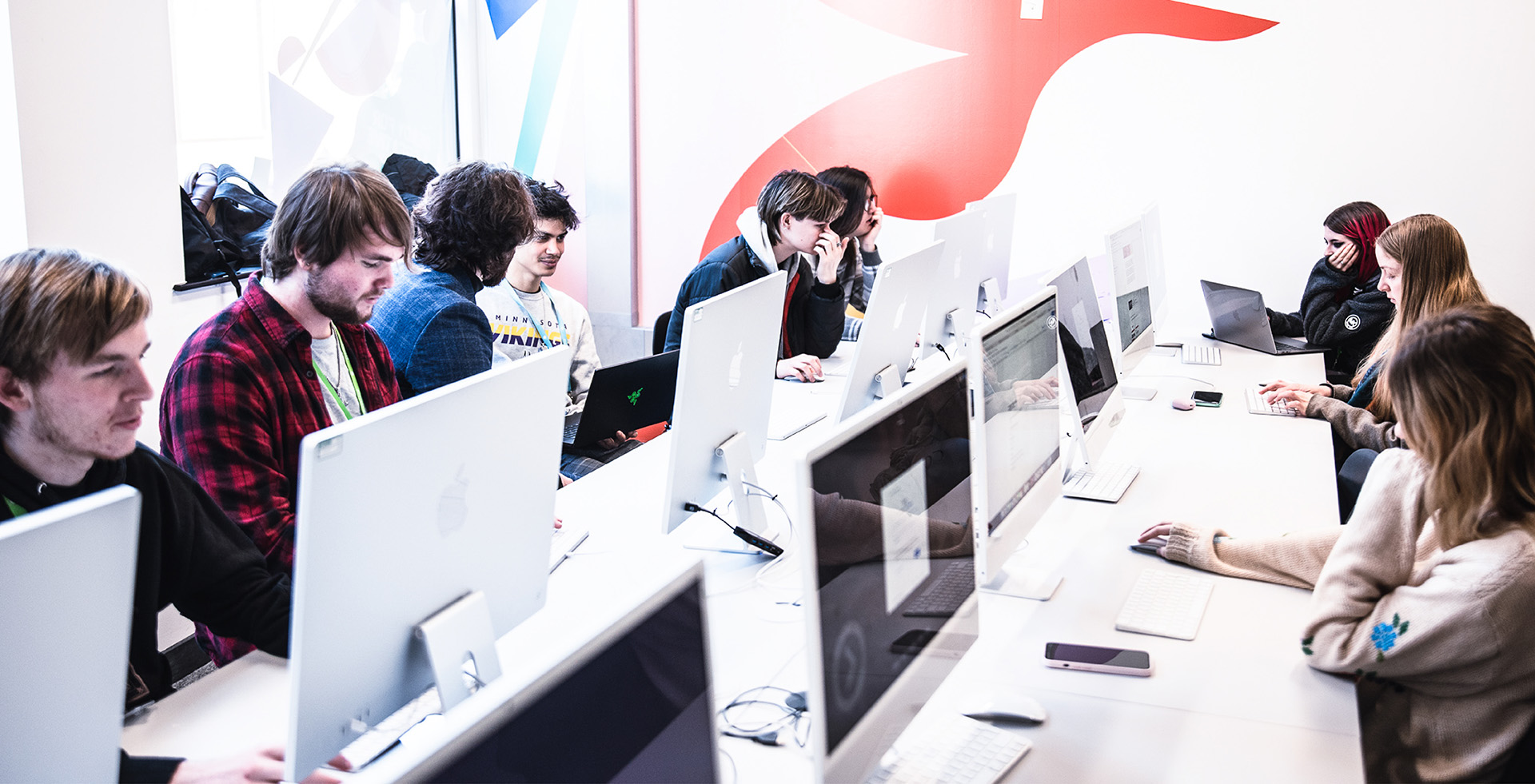 Group of ACC Bristol students working in media suite