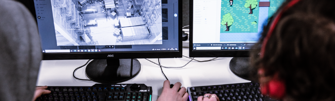 Two people working at computers