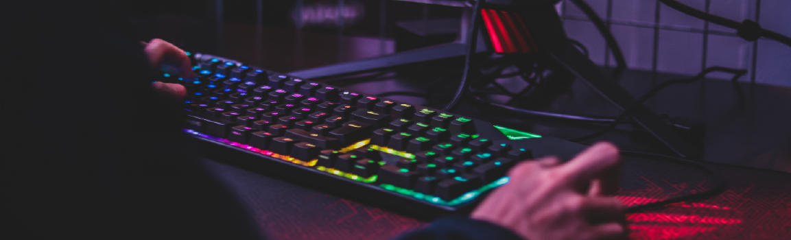An image of a keyboard, mouse and a pair of hands using them