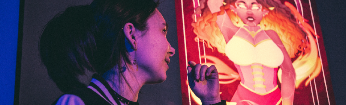 Female looking at projected image of artwork
