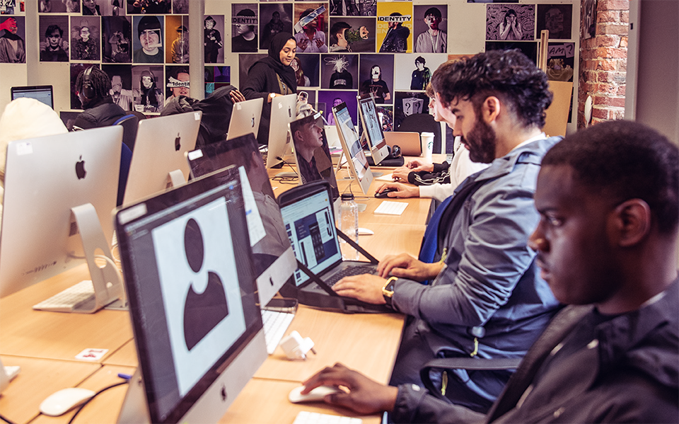 A group of people working at computers