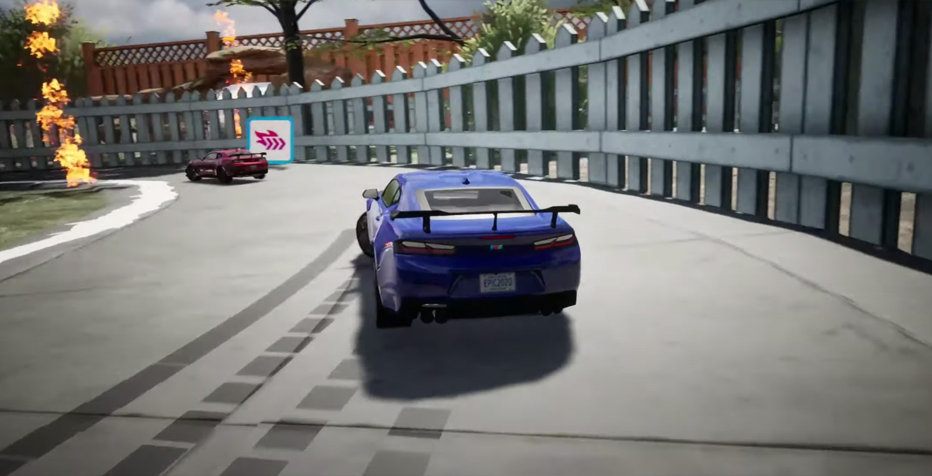 A screenshot of a racing game, with a blue sports car drifting round a corner
