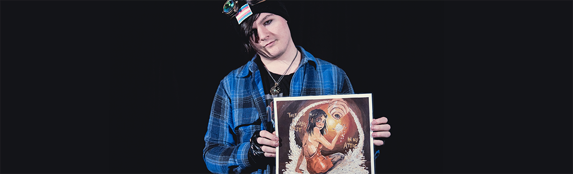 A person holding up a drawn artwork