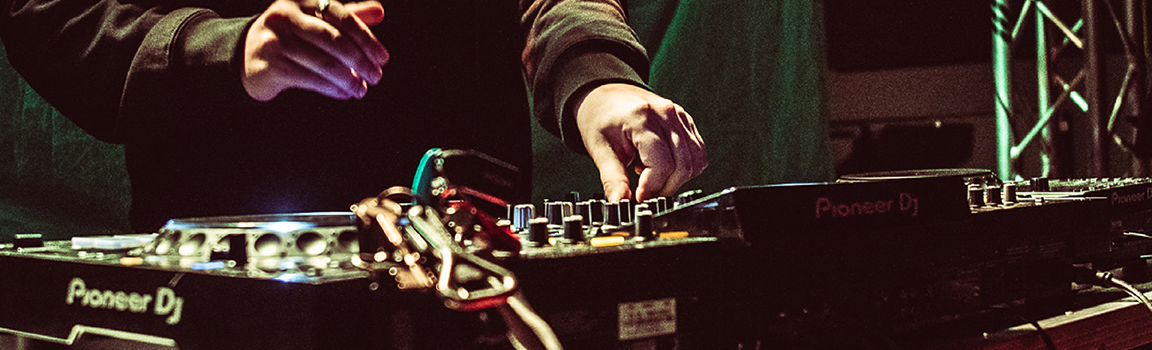 A person working at DJ decks