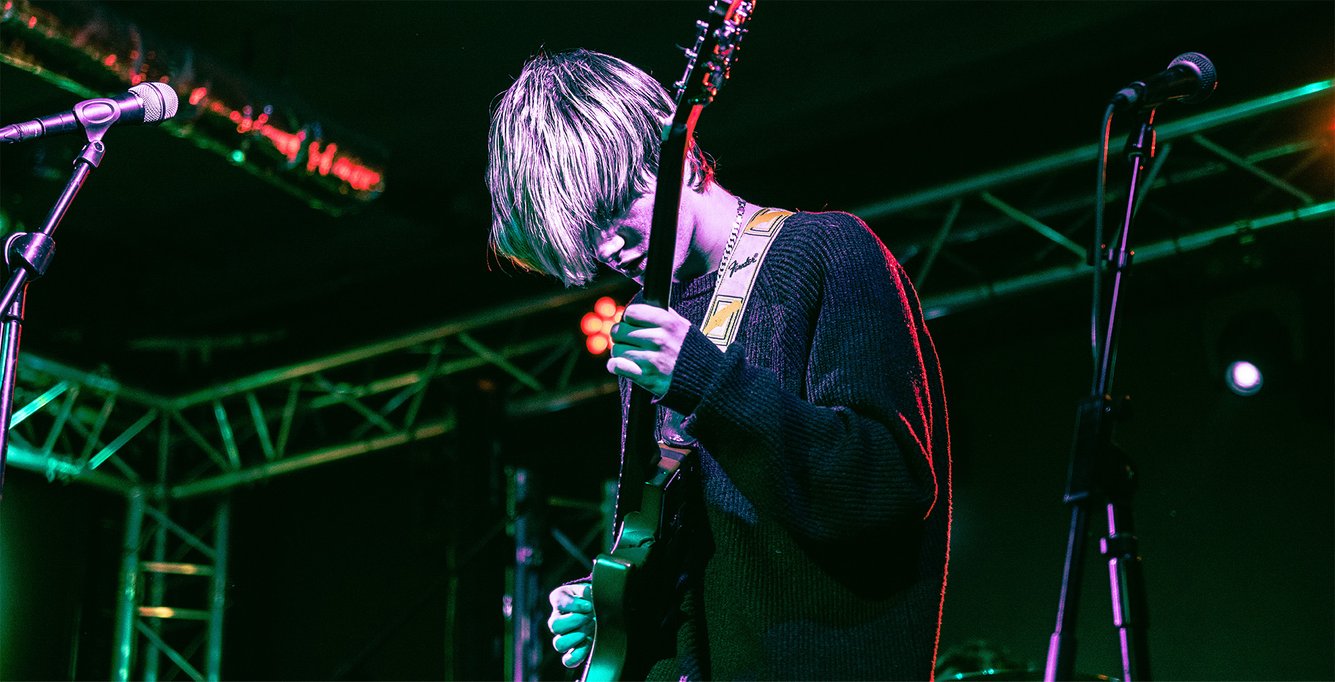 A person playing guitar on stage