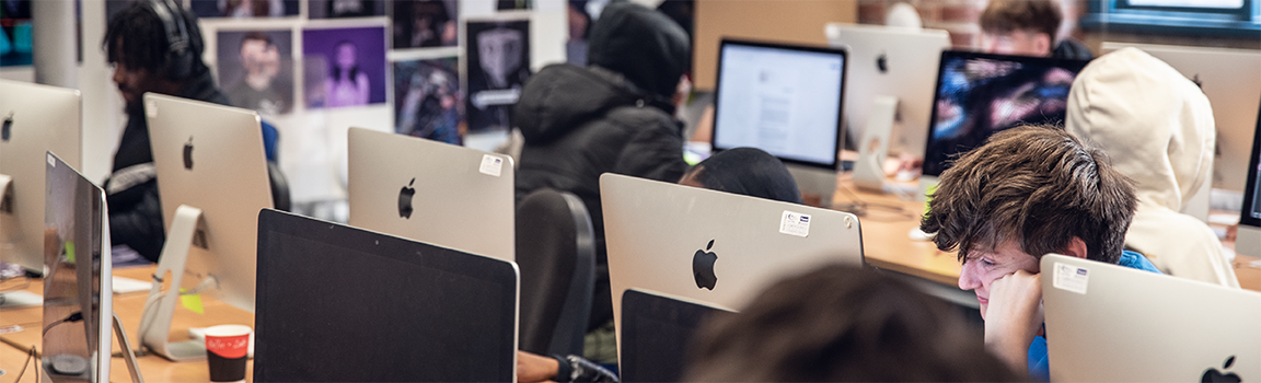A group of people working at computers