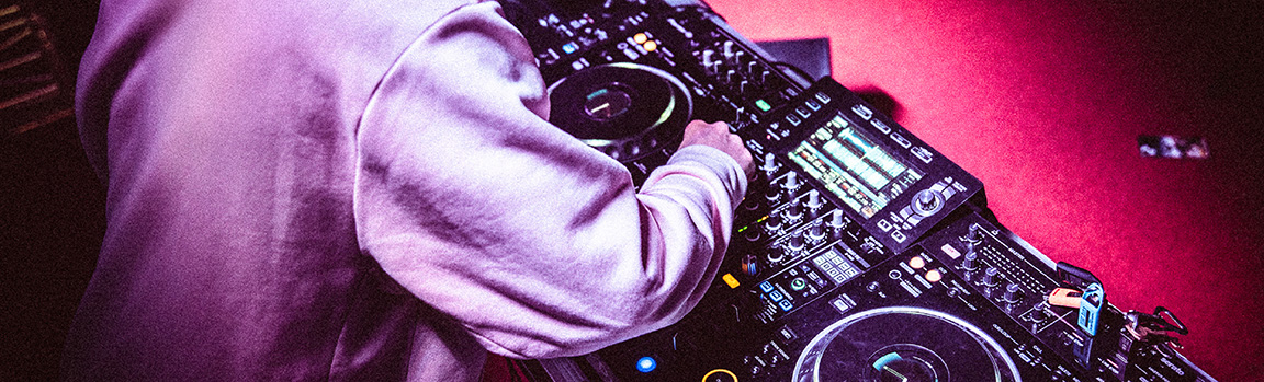 A person working at DJ decks