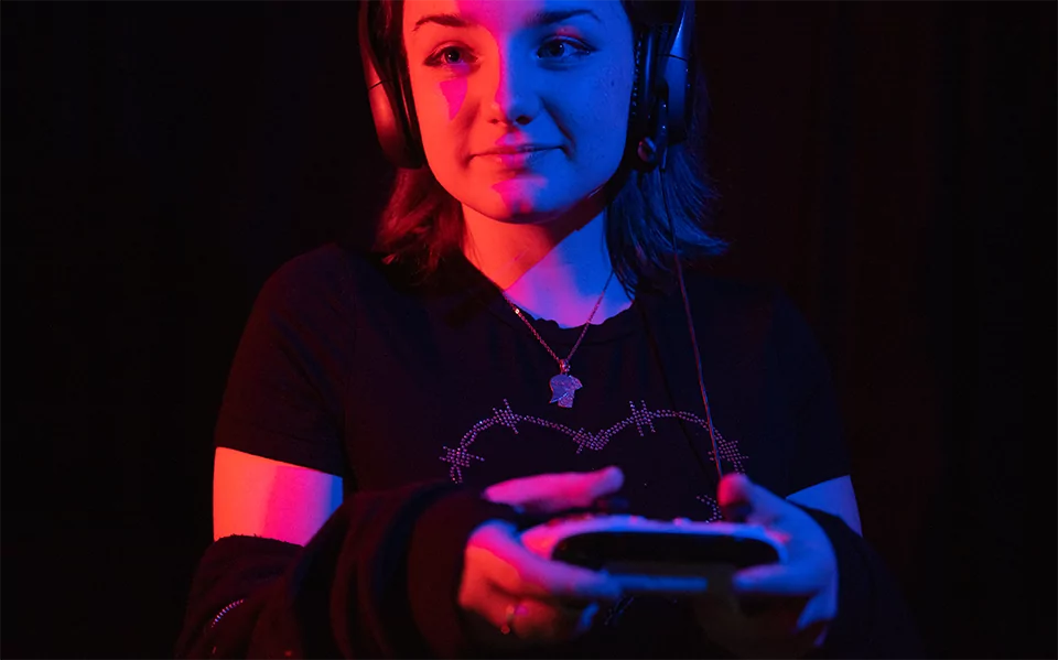 A female using a game controller