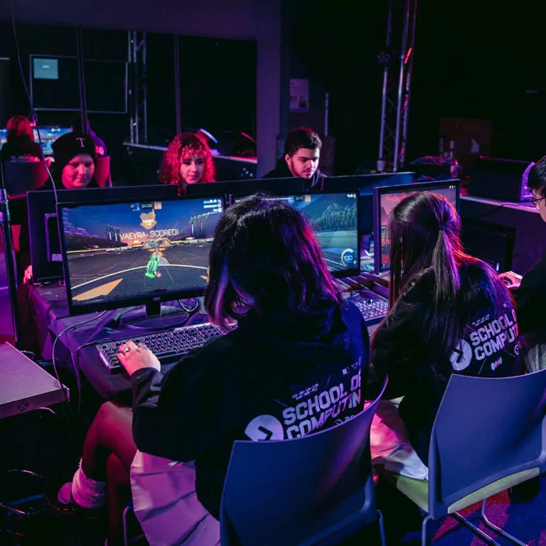 A group of people participating in an esports tournament