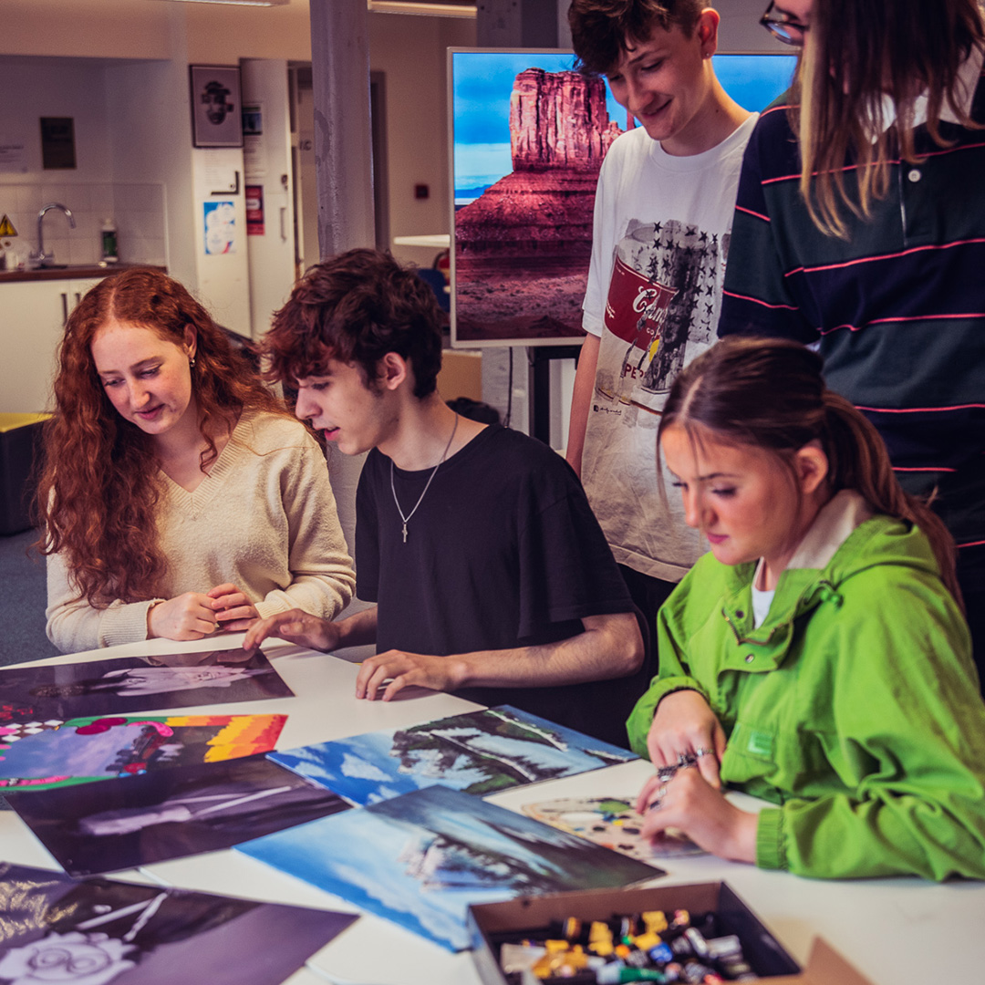 Students working with mixed media to build a creative portfolio