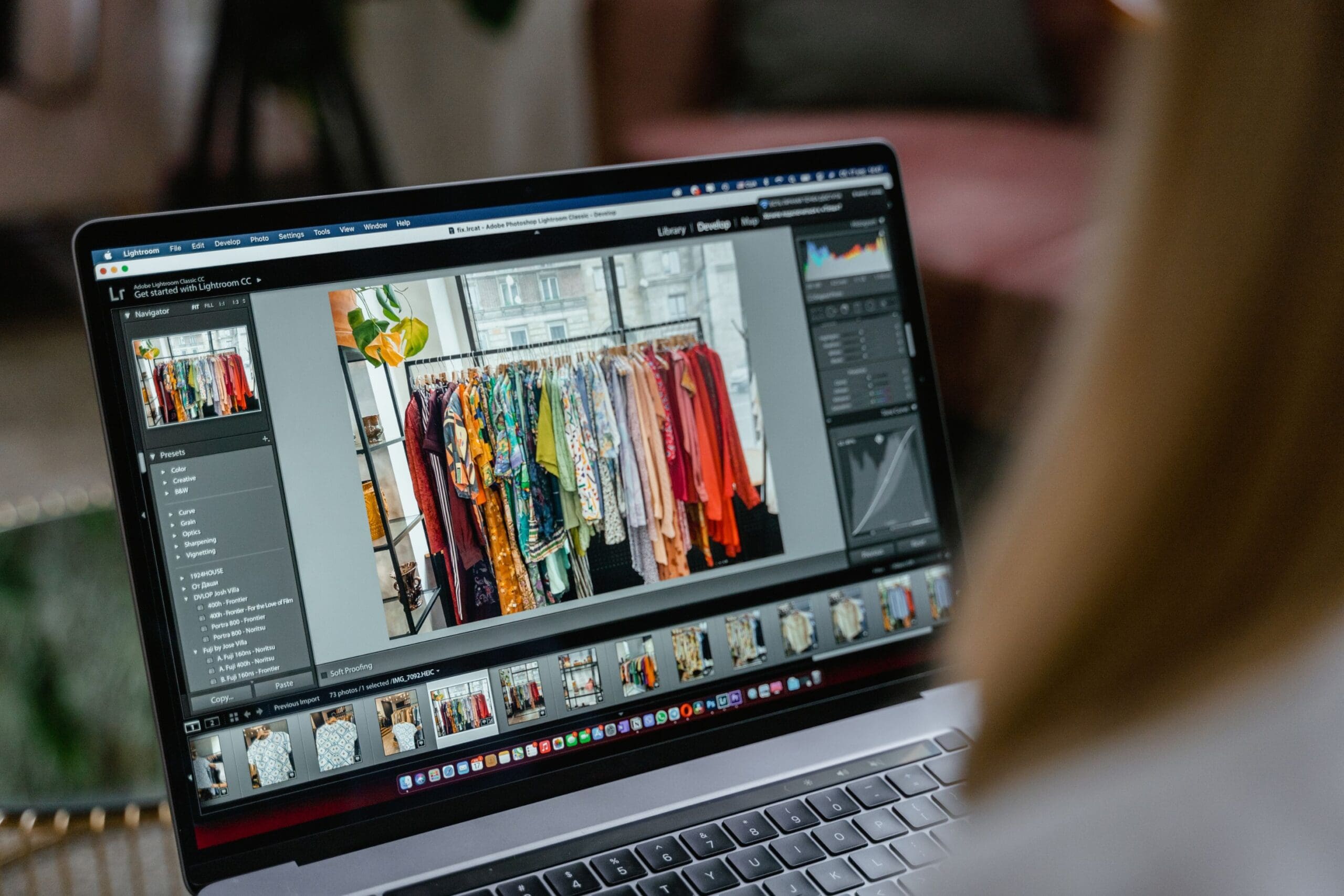 Digital marketer working on photo editing on laptop