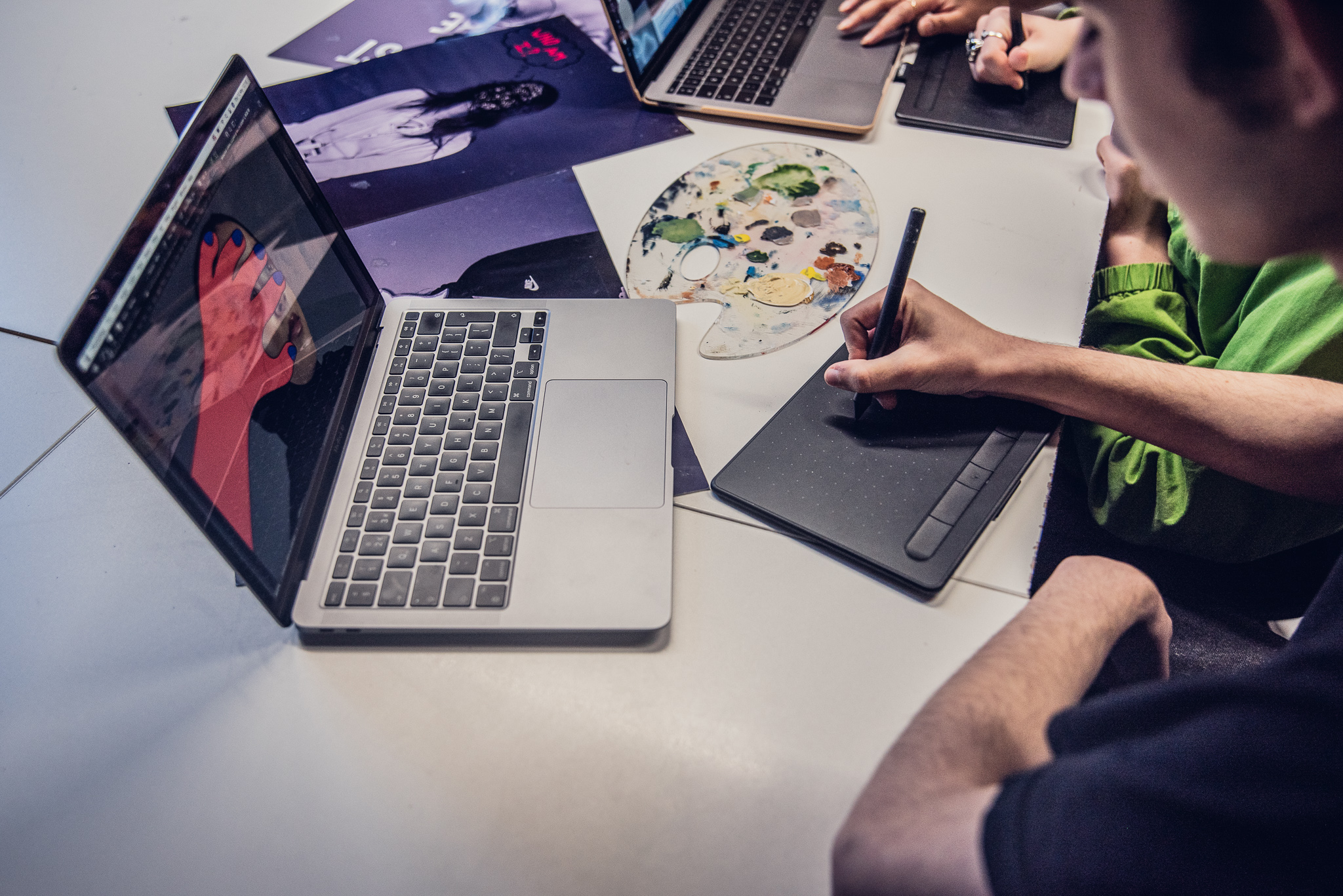 Graphic design students using mouse for laptop