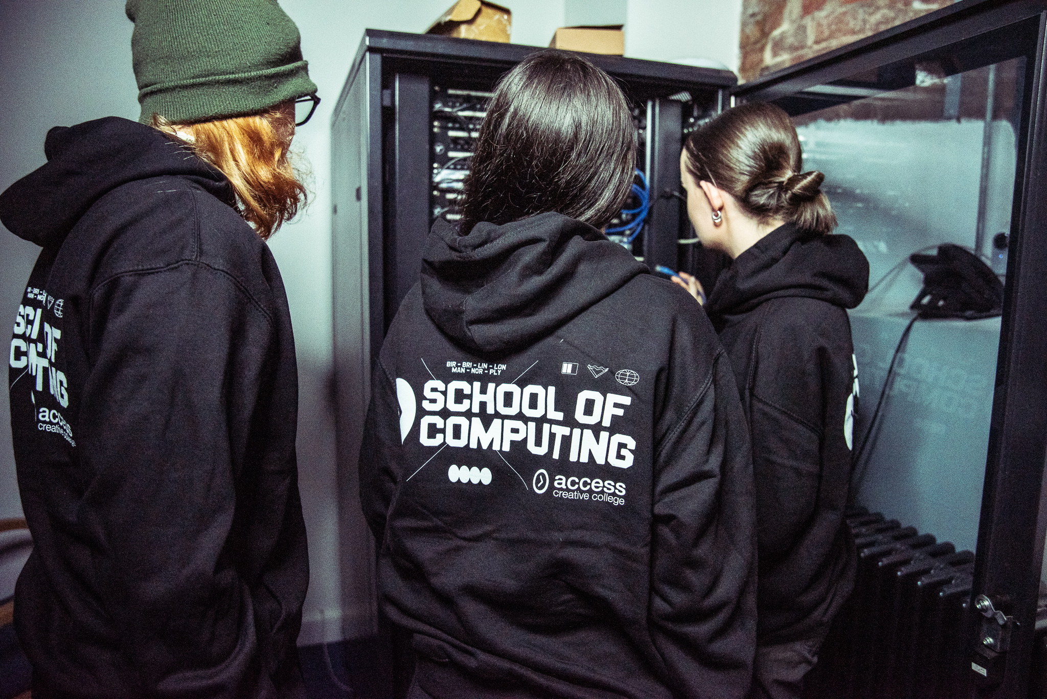 T Level students wearing 'School of Computing' hoodies