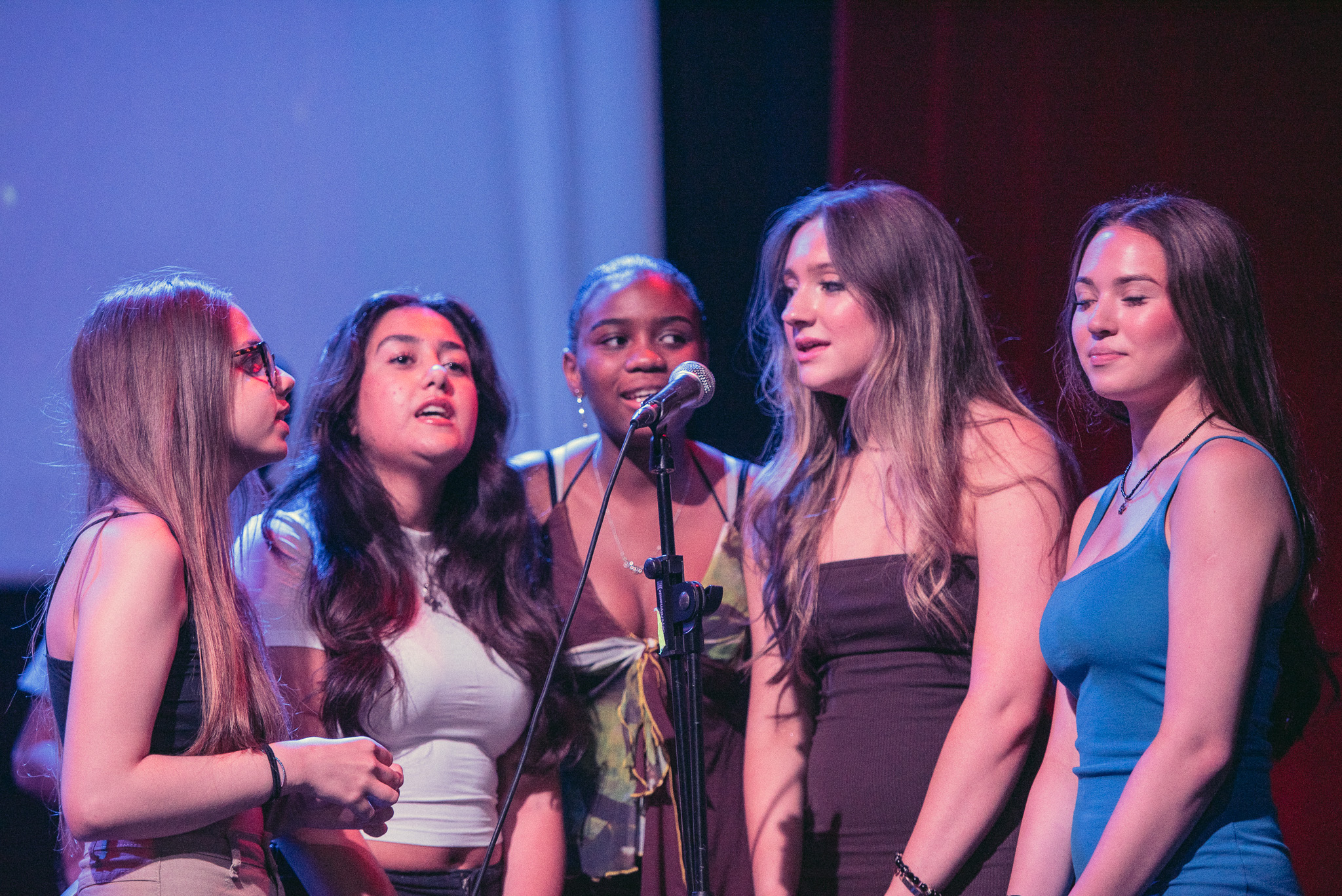 Group of music artists singing together