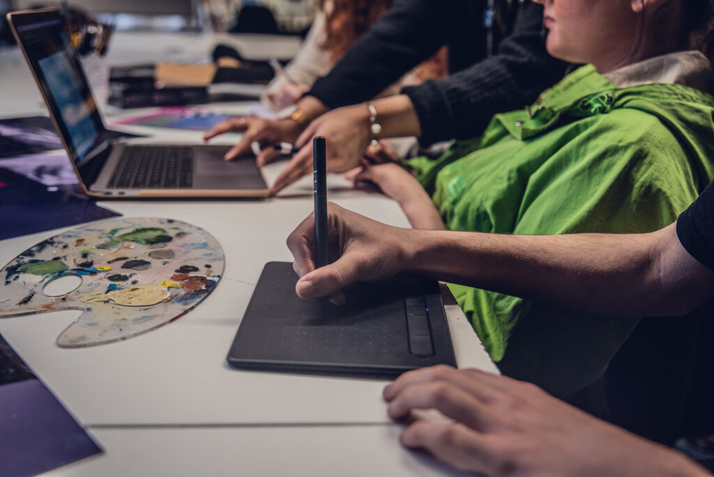 VFX student using tablet to make a design