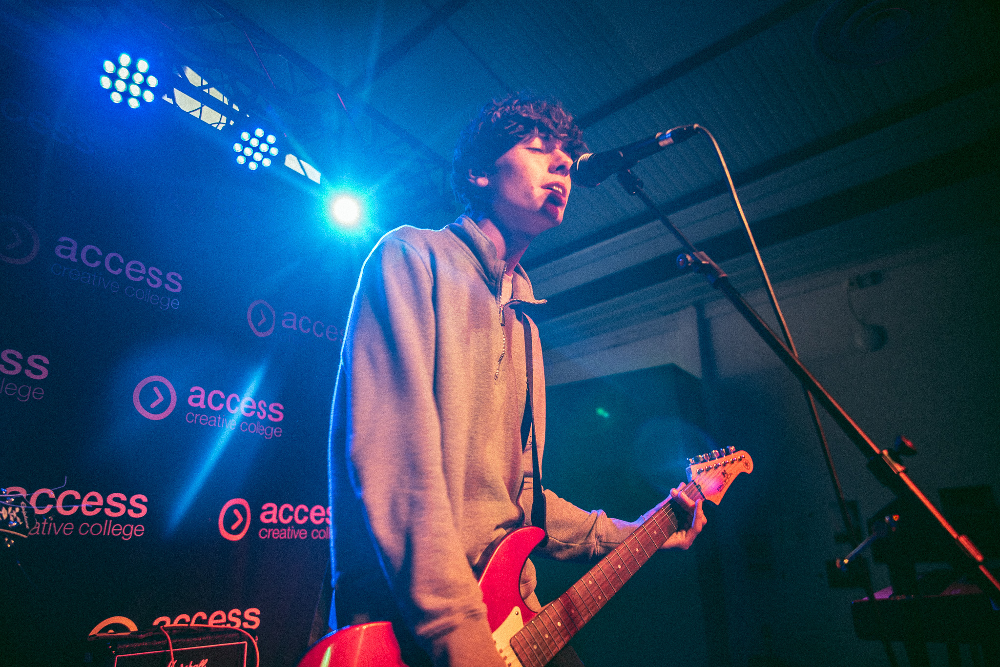 ACC Birmingham music student playing guitar on stage