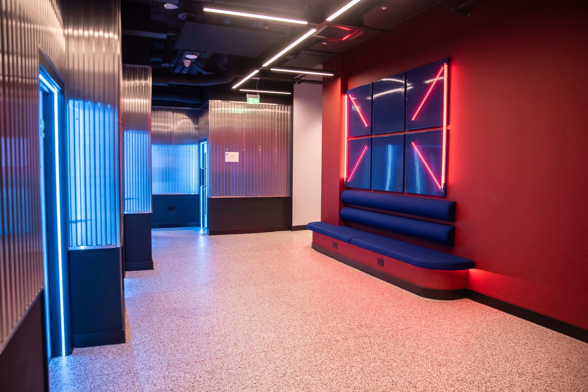 ACC London campus corridor with seating