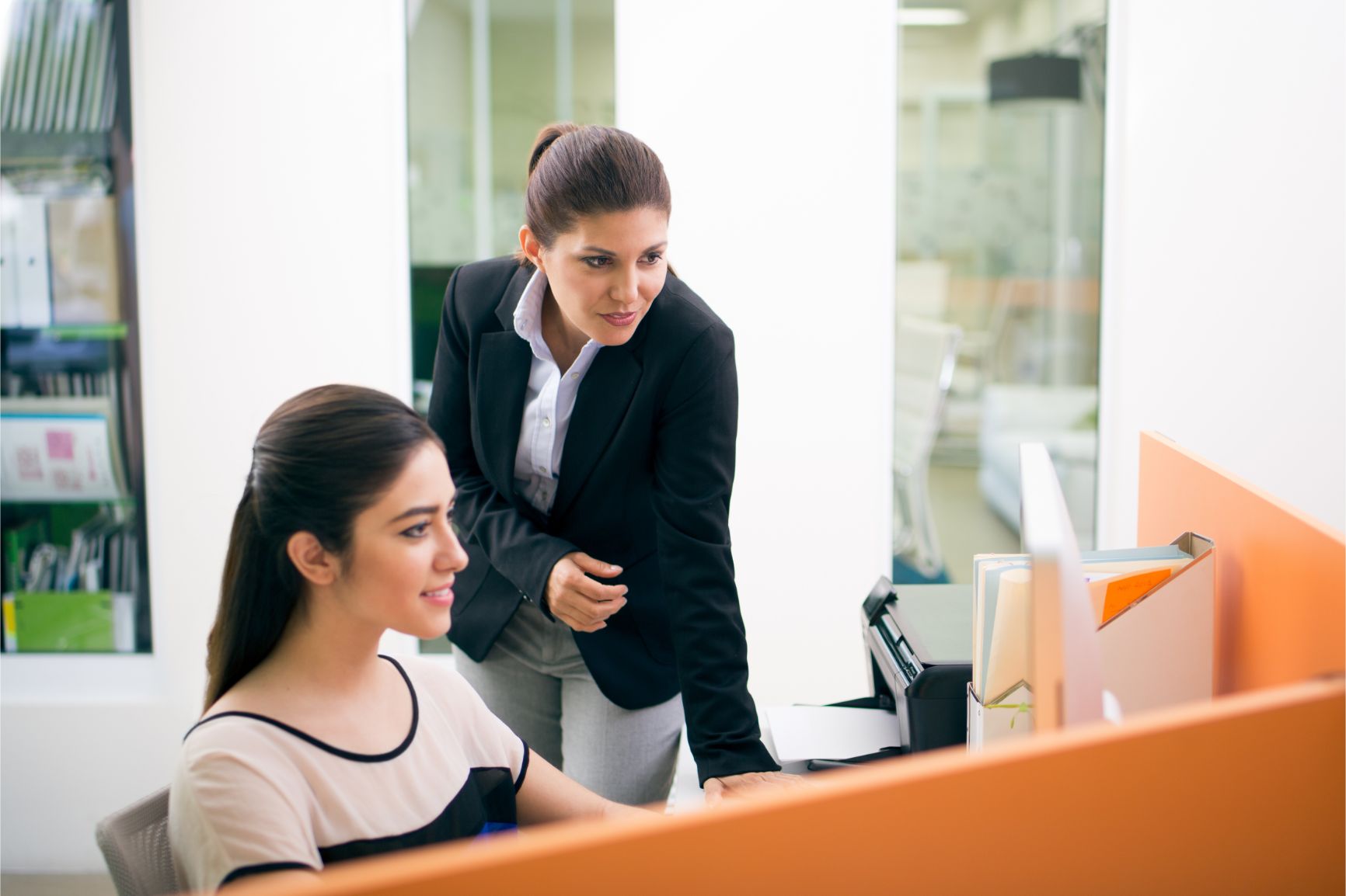 Boss training office worker