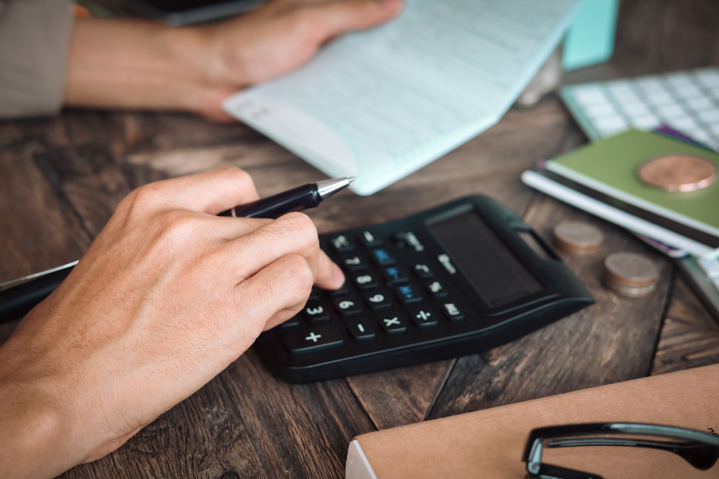 Person using calculator to work out apprenticeship levy