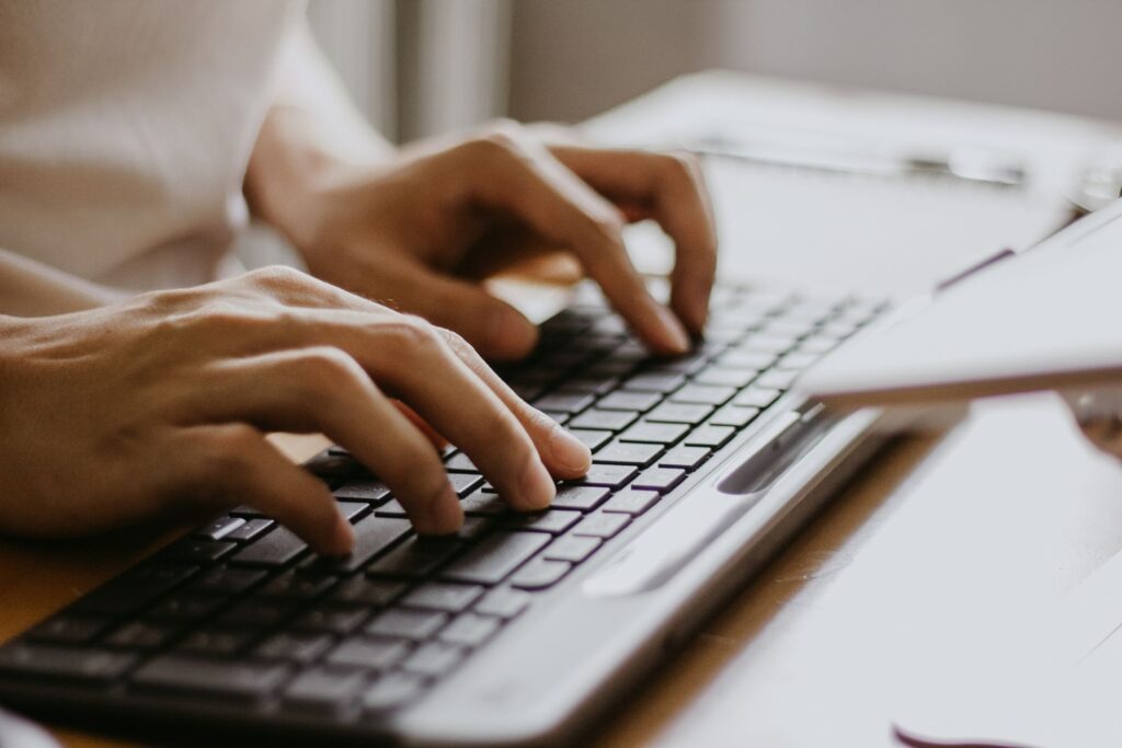 Woman typing on laptop
