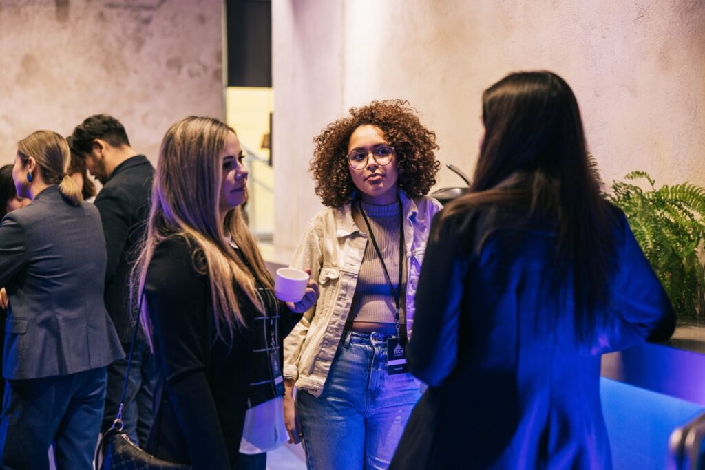 Students at an apprenticeship networking event speaking to employers