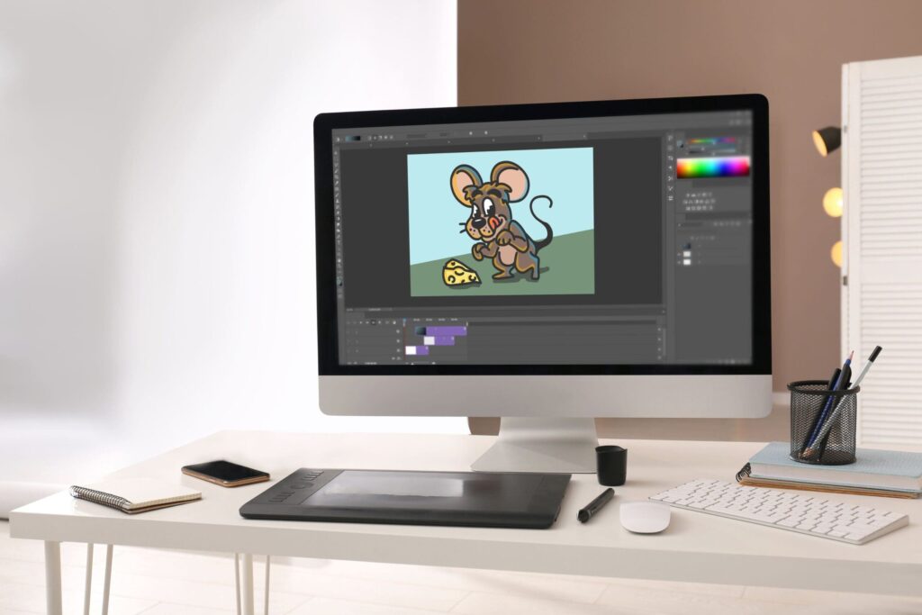 What can I do with a Graphic Design qualification? 6 VFX artist's computer with cartoon of mouse