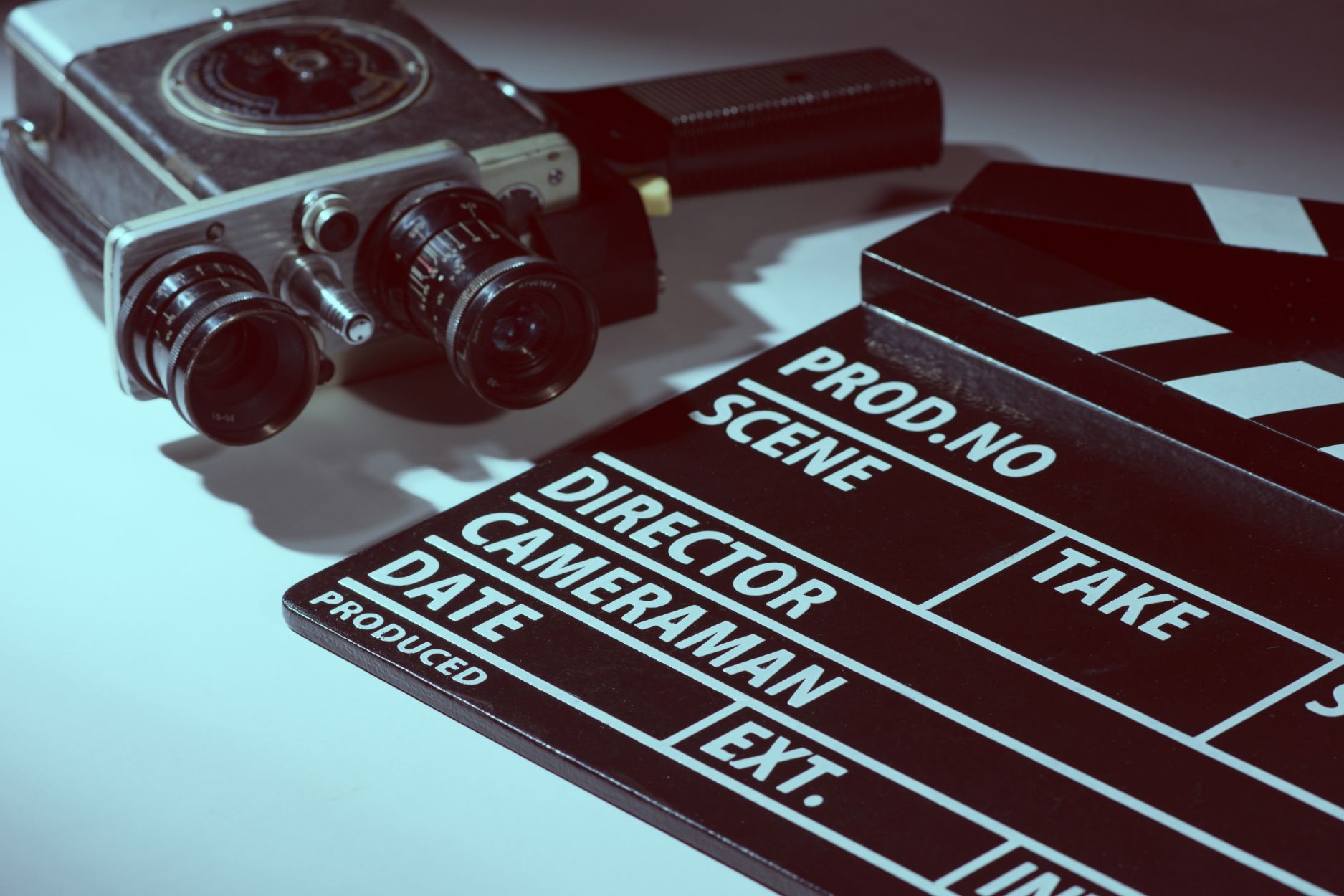 Clapperboard and camera next to each other