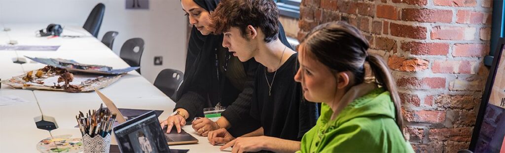 What skills do you need as a content creator? 6 Content Creation students working together in class