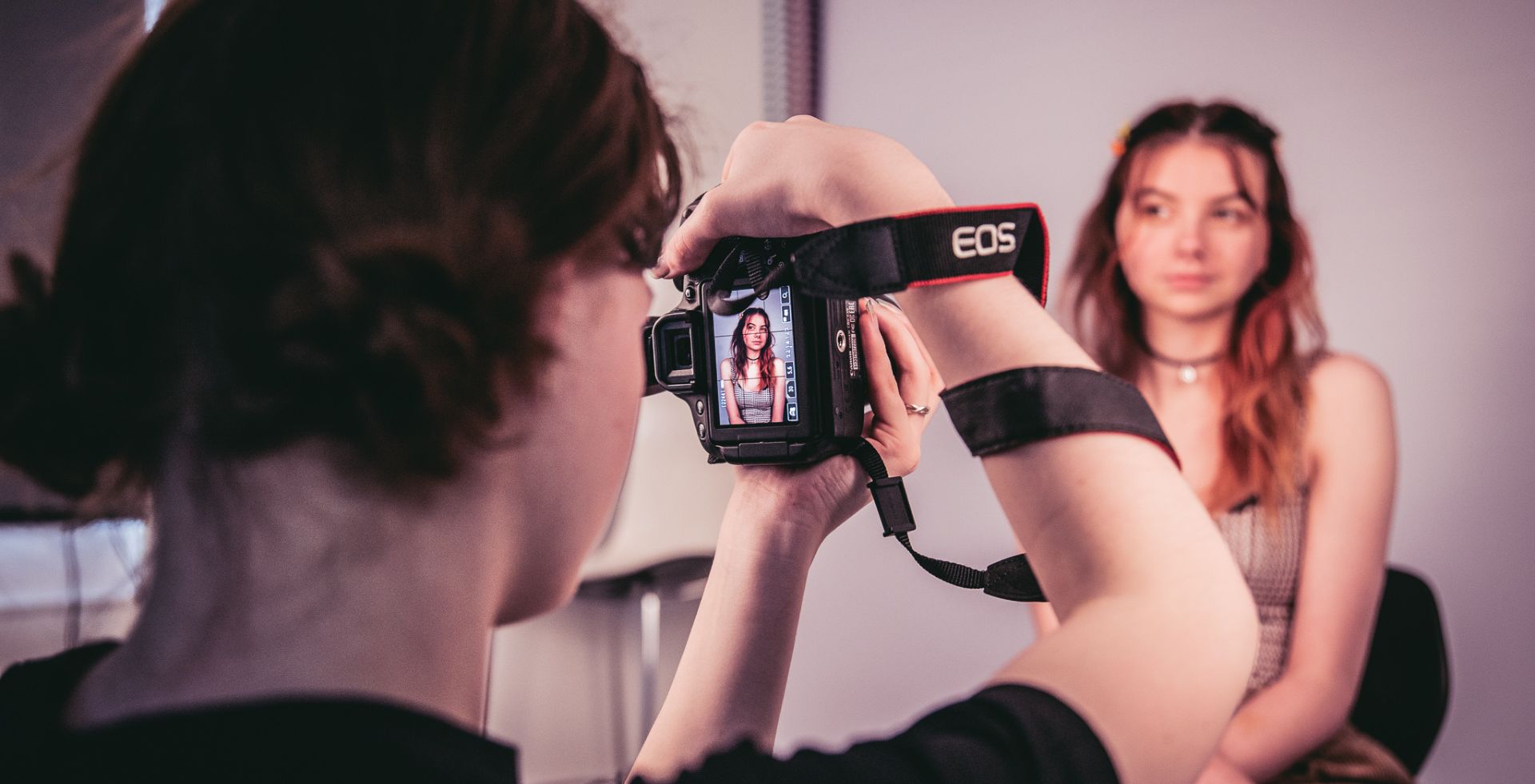 Content creation student during photoshoot of female student