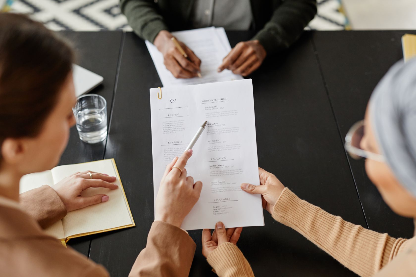 Crafting Your First CV: A Step-by-Step Guide for College Students 4 Employers looking at applicant's CV