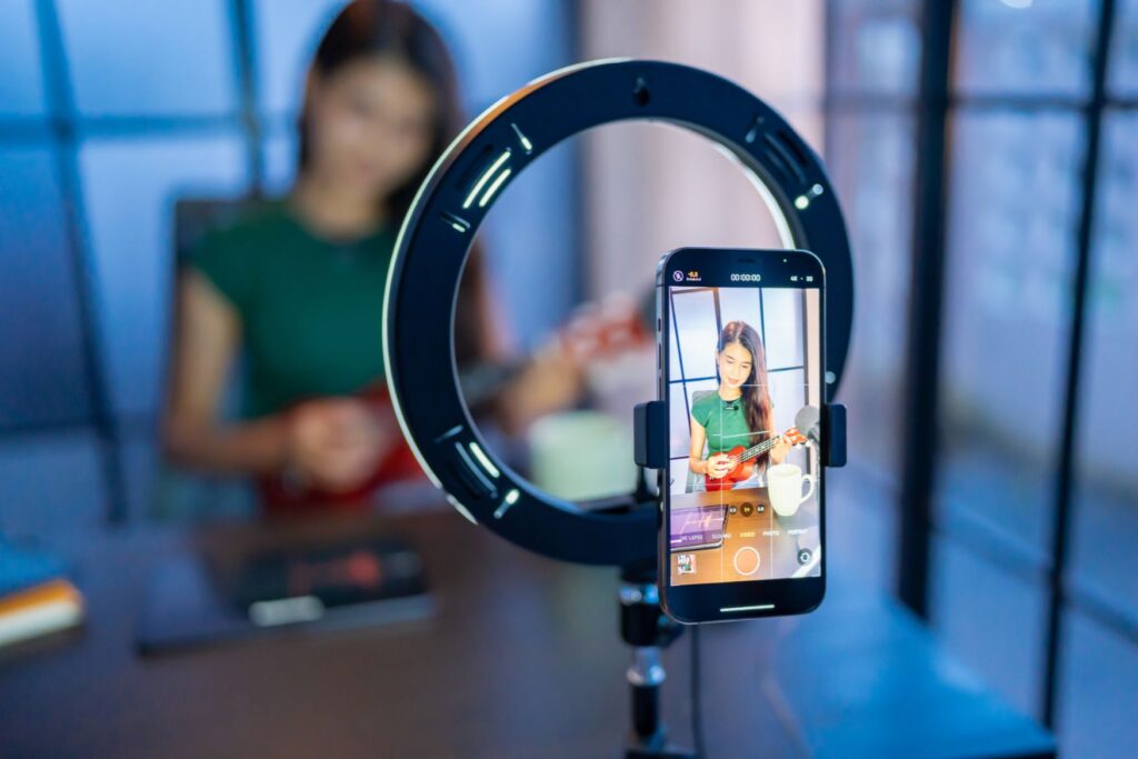 How to film an amazing music video: A step-by-step guide 6 Content creator making music video on phone
