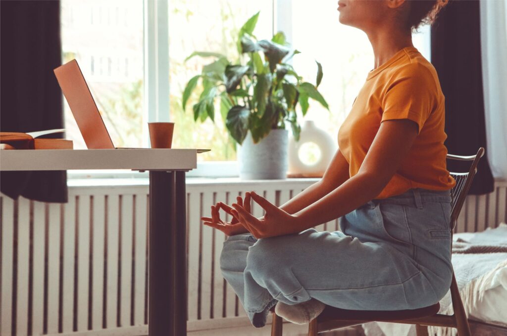 How to deal with assignment stress 5 Student meditating in front of laptop