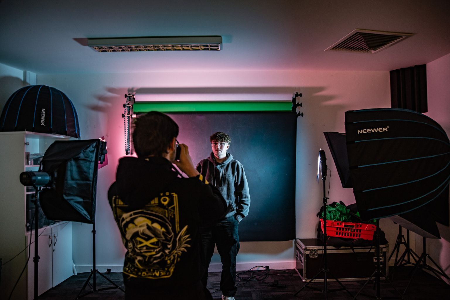 Access Creative College photography students, taking photos in the studio