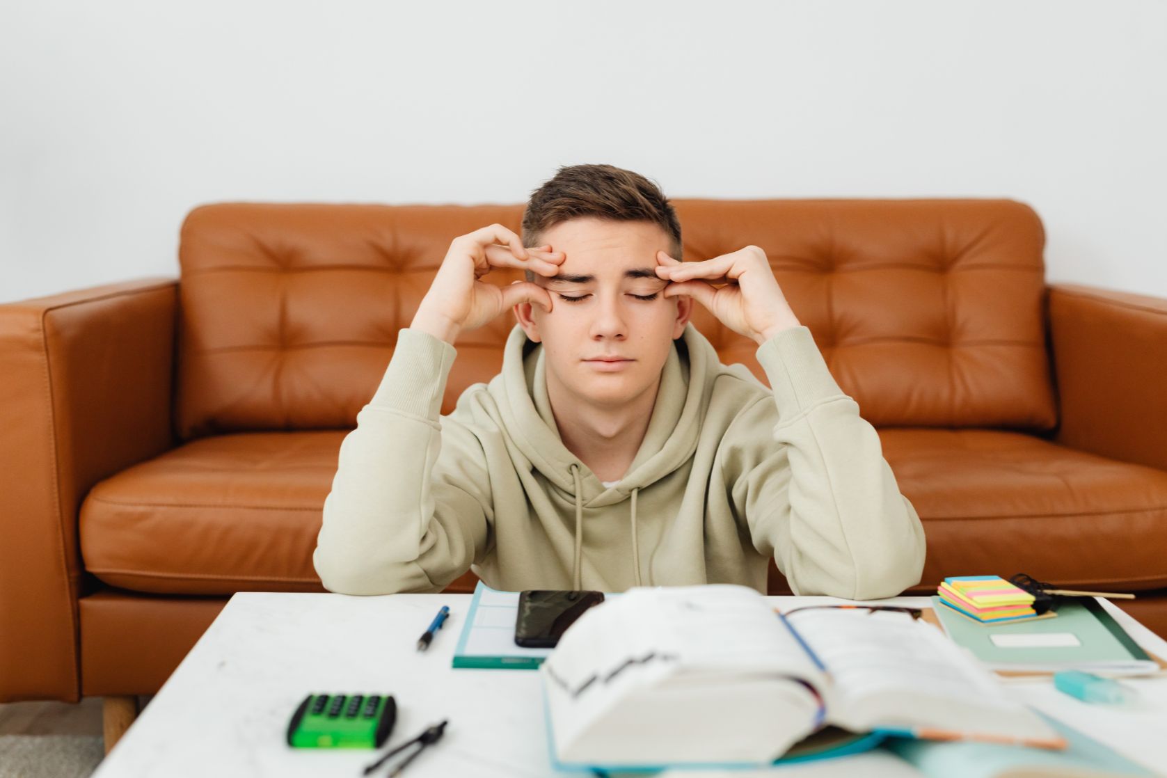 Male student stressed by assignment