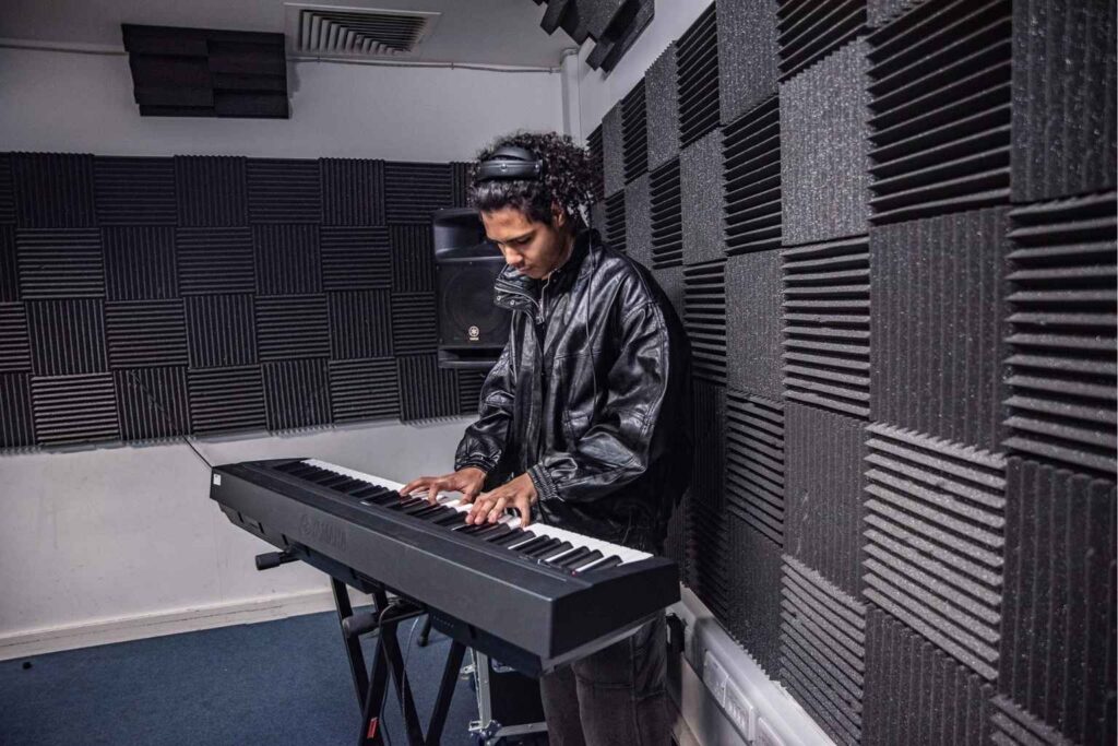 10 reasons to seriously consider a career in the music industry 10 ACC Bham student playing on keyboard