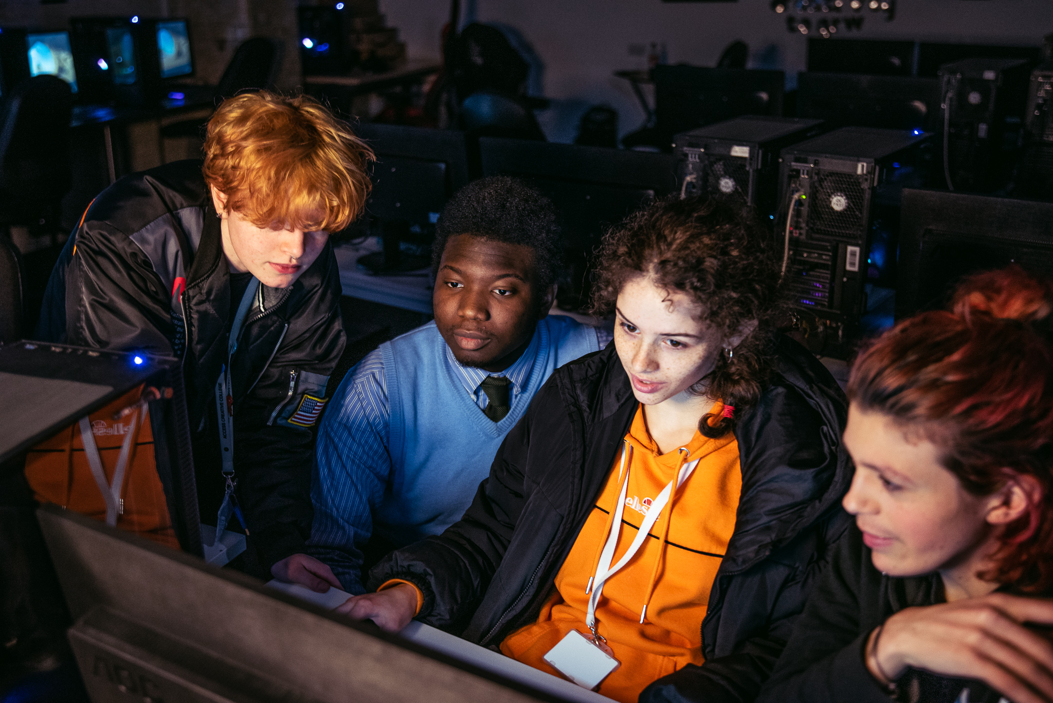 students around a computer screen