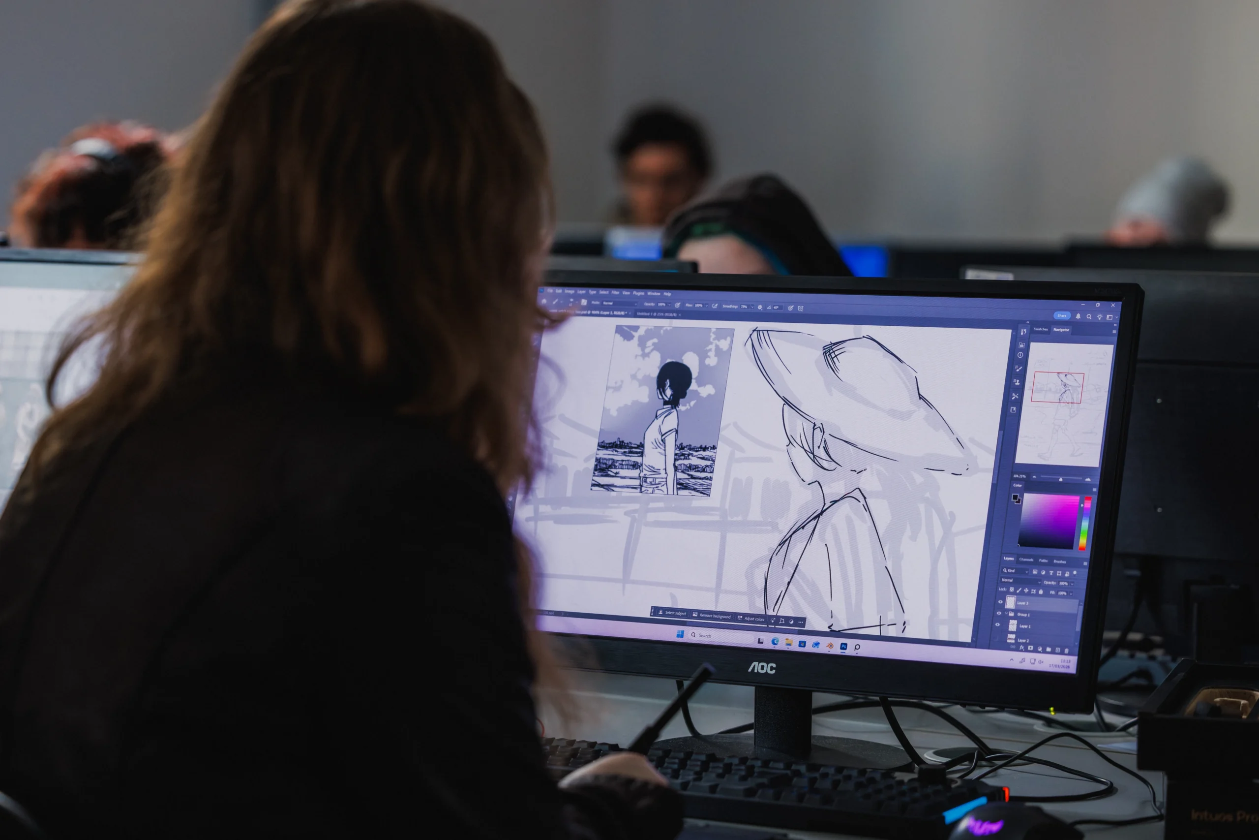 Access Creative College student on computer doing a Games Art assignment