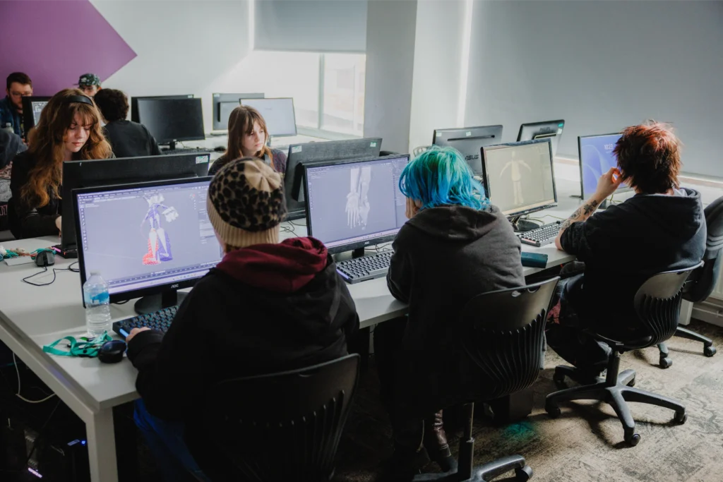 What's the difference between games art and games development? 1 image of Access Creative College students studying at computers doing 3D games characters